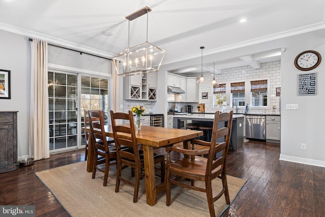 631 Monument Ave, Malvern, PA 19355 - dining room with beam ceiling, dark wood-type flooring, baseboards, and ornamental molding