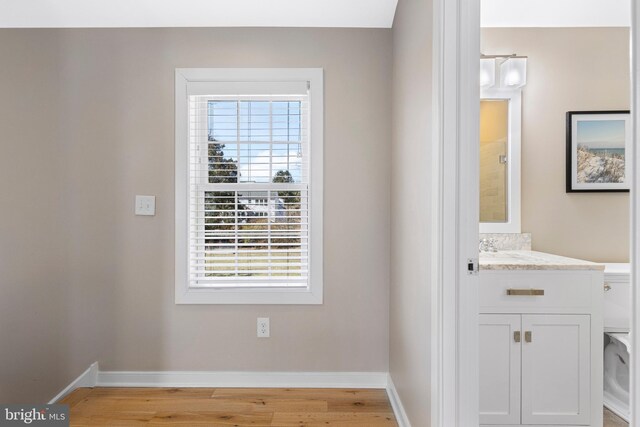 631 Monument Ave, Malvern, PA 19355 - bathroom featuring baseboards, wood finished floors, and vanity