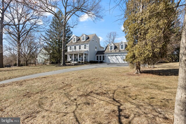 631 Monument Ave, Malvern, PA 19355 - view of front of home with covered porch, driveway, an attached garage, and a front yard