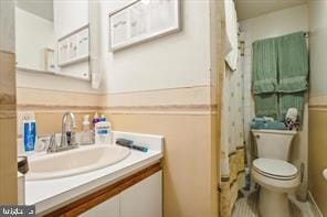 bathroom featuring vanity and toilet