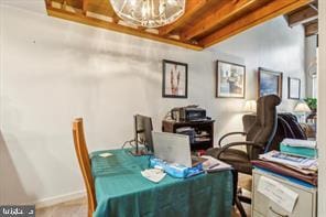 dining room with baseboards and a chandelier