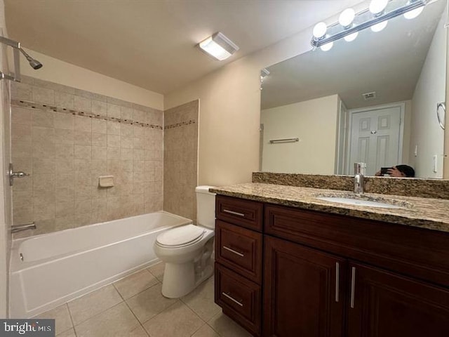 full bathroom with visible vents, toilet, shower / bathtub combination, tile patterned floors, and vanity