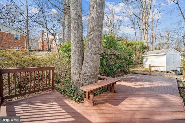 deck featuring an outdoor structure and a shed