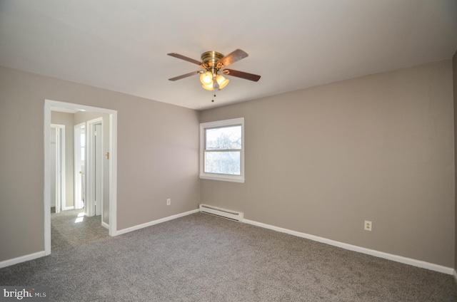 spare room featuring ceiling fan, dark colored carpet, a baseboard radiator, and baseboards