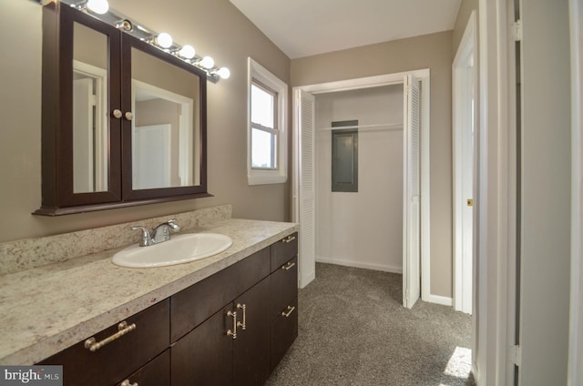 bathroom with vanity and baseboards