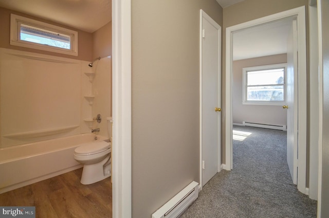 full bath featuring toilet, plenty of natural light, a baseboard radiator, and a baseboard heating unit