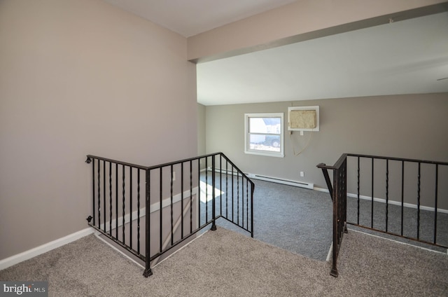 stairs with lofted ceiling, carpet floors, a baseboard radiator, and baseboards