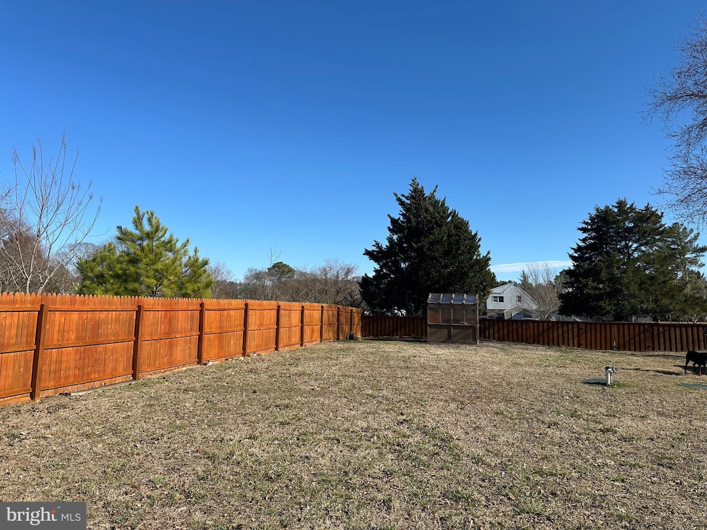 view of yard with a fenced backyard