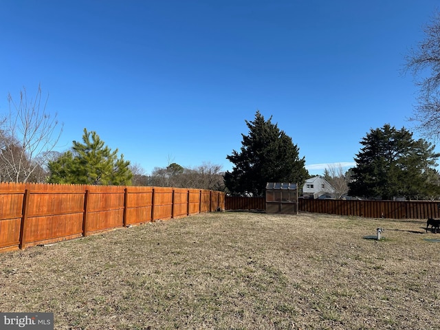 view of yard with a fenced backyard