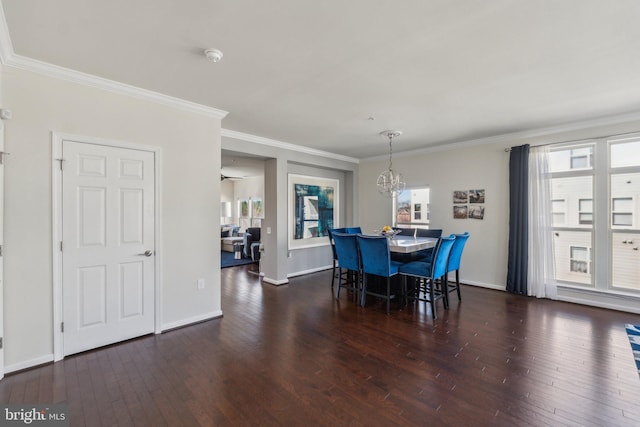 dining room with a wealth of natural light, baseboards, and hardwood / wood-style floors