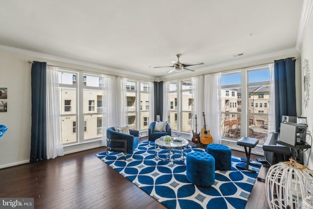 interior space featuring hardwood / wood-style floors, baseboards, ornamental molding, and ceiling fan