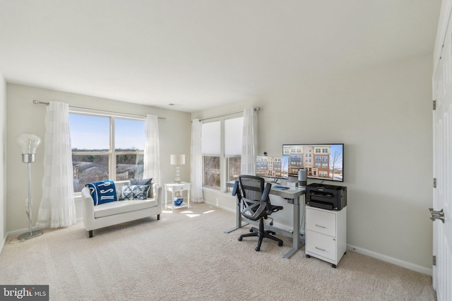 office with light colored carpet and baseboards