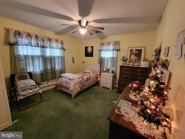 carpeted bedroom featuring visible vents, baseboard heating, and ceiling fan