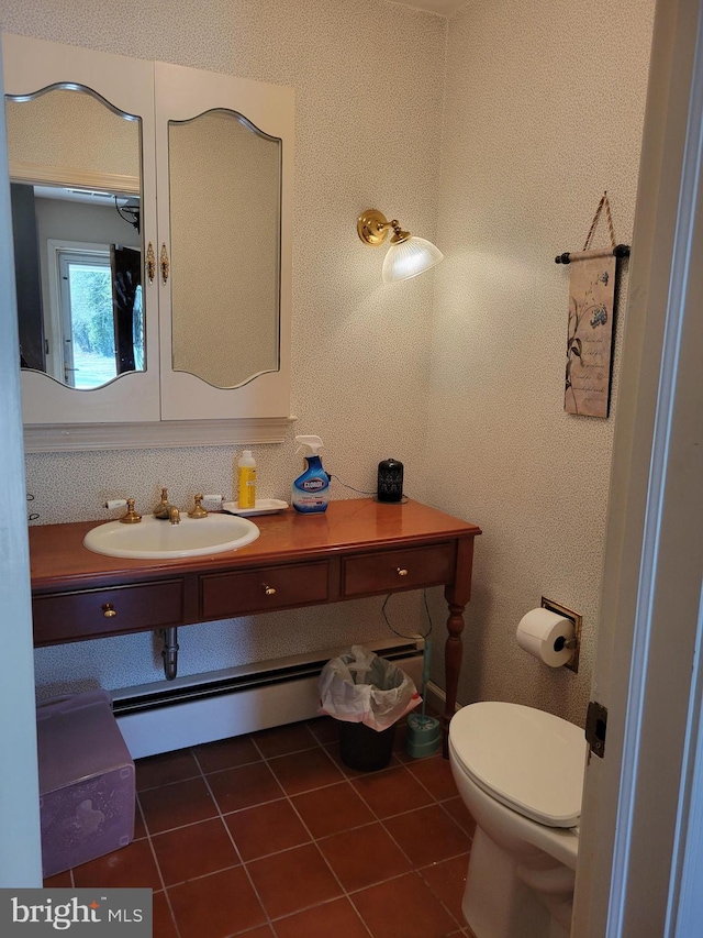 bathroom featuring vanity, tile patterned floors, toilet, and a baseboard radiator