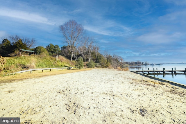 view of home's community featuring a water view and a boat dock