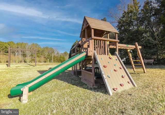 community jungle gym with a yard