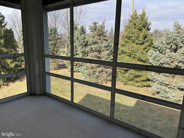 unfurnished sunroom with plenty of natural light