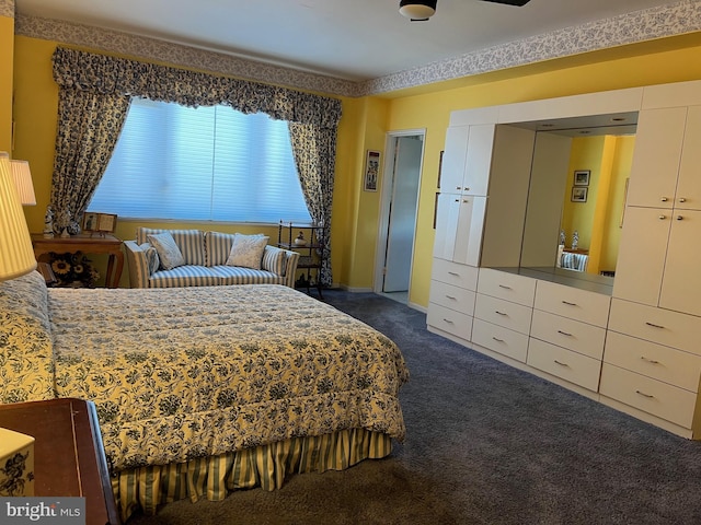 bedroom featuring dark colored carpet