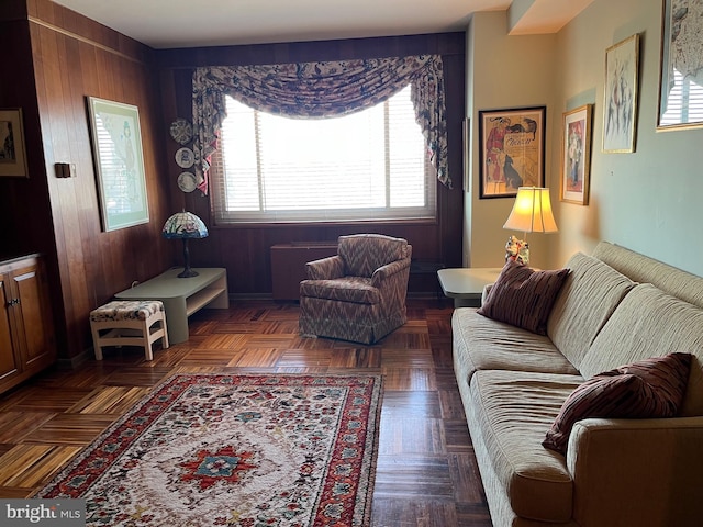 living area featuring wooden walls