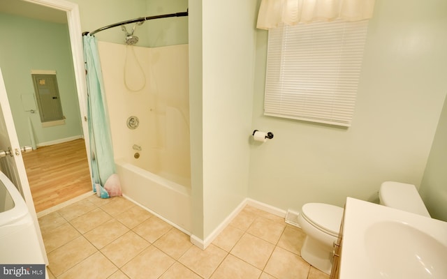 full bathroom with tile patterned flooring, toilet, baseboards, and a sink