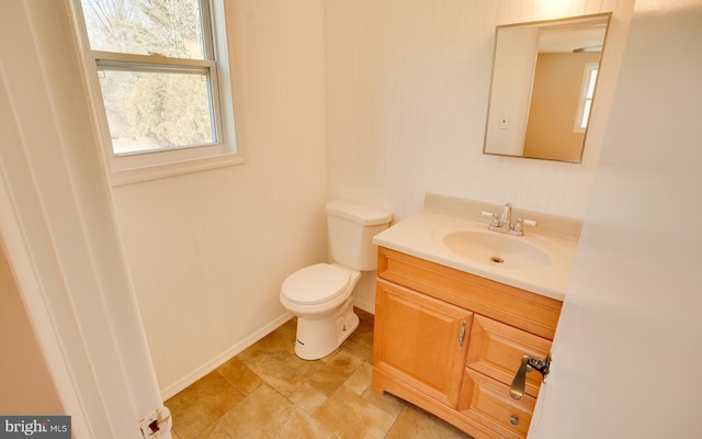 bathroom featuring toilet and vanity