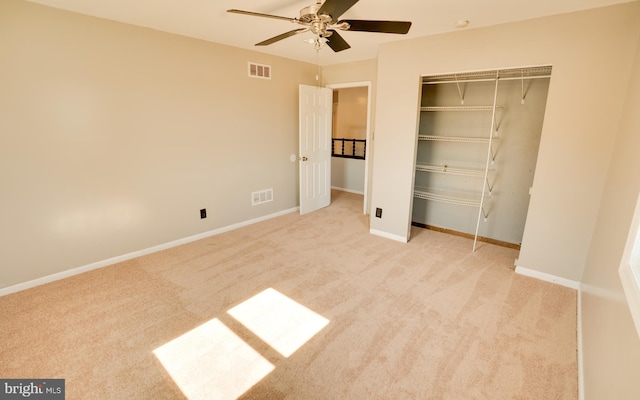 unfurnished bedroom featuring visible vents, baseboards, a closet, and carpet flooring