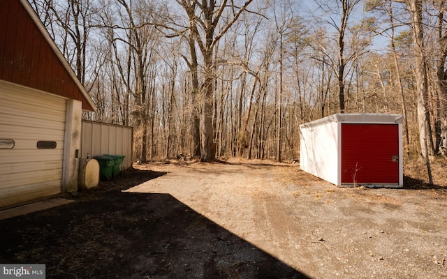 view of yard with an outbuilding and a shed