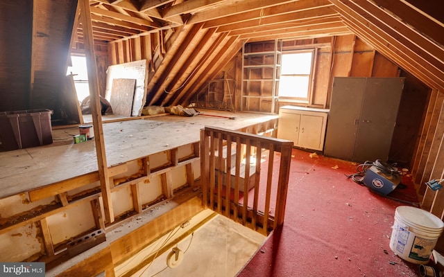 attic featuring an upstairs landing