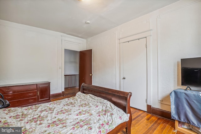 bedroom featuring wood finished floors