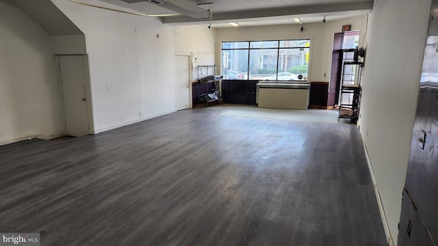 unfurnished living room featuring wood finished floors