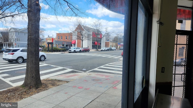 view of street with a residential view and sidewalks