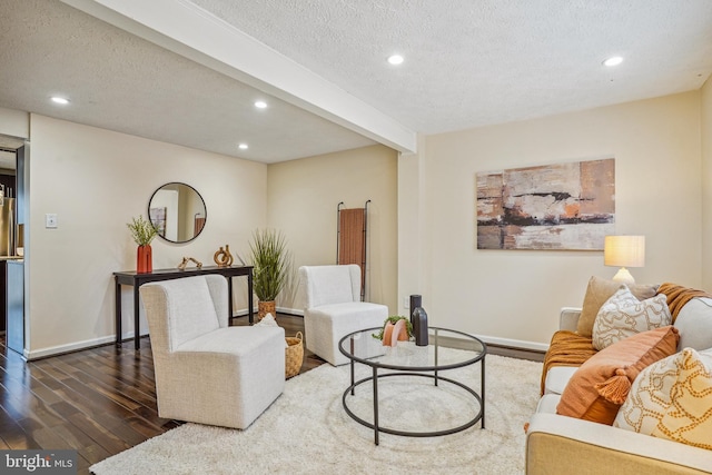 living room with recessed lighting, a textured ceiling, and dark wood-style floors