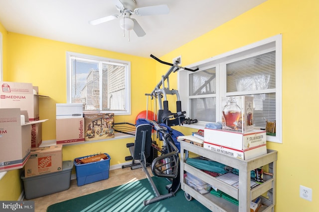 office space with ceiling fan and tile patterned flooring