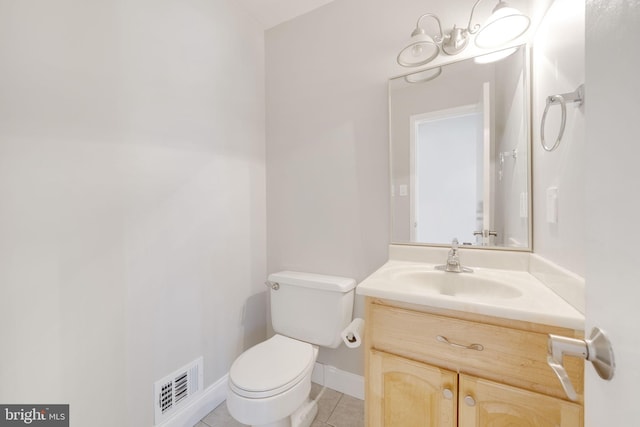 bathroom featuring tile patterned flooring, visible vents, baseboards, toilet, and vanity