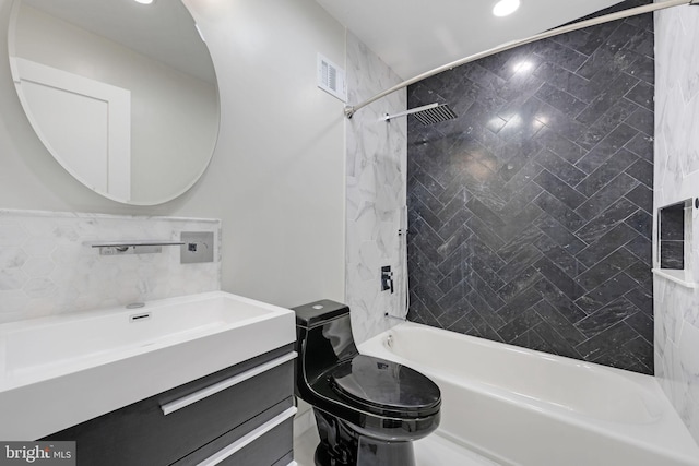 bathroom with vanity, toilet, visible vents, and shower / bath combination