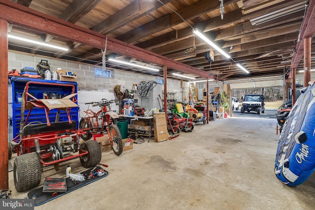 garage with concrete block wall