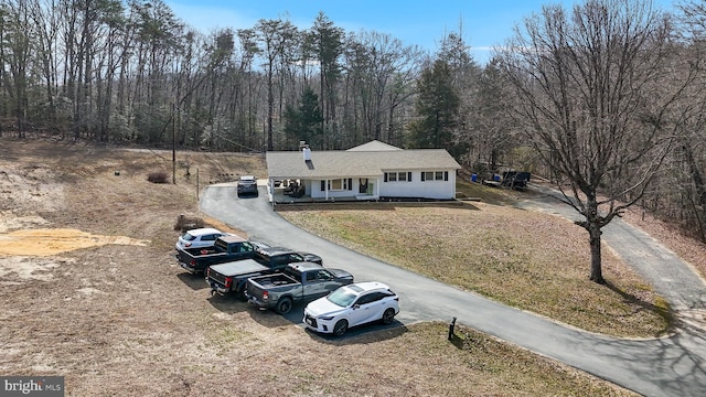 drone / aerial view featuring a view of trees