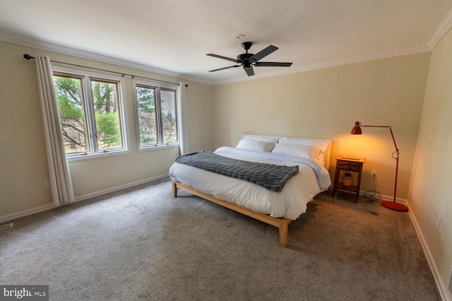 carpeted bedroom featuring visible vents, a ceiling fan, crown molding, and baseboards