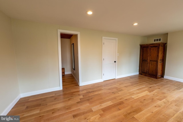 unfurnished bedroom with recessed lighting, baseboards, visible vents, and light wood-type flooring