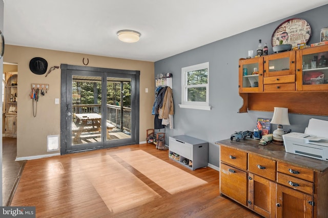 interior space with wood finished floors and baseboards