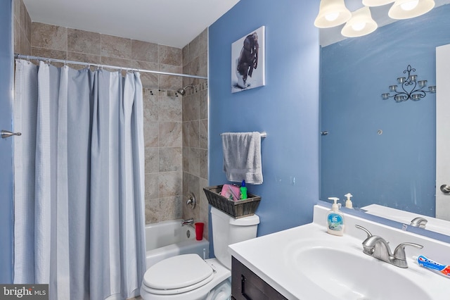 full bath featuring toilet, vanity, and shower / bath combo