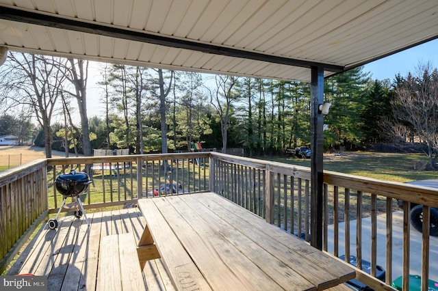 deck featuring a lawn and a fenced backyard