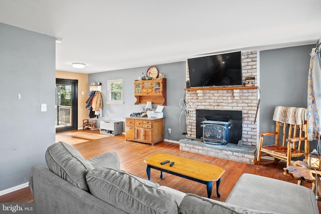 living room featuring wood finished floors and baseboards