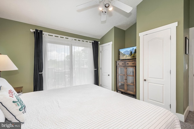 carpeted bedroom with lofted ceiling, access to exterior, and ceiling fan