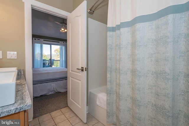 bathroom featuring ensuite bath, vanity, a ceiling fan, and tile patterned floors