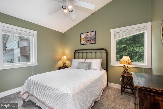 carpeted bedroom with lofted ceiling, ceiling fan, and baseboards