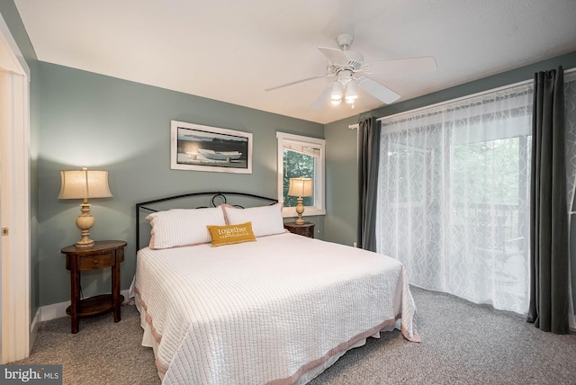 carpeted bedroom featuring ceiling fan and baseboards