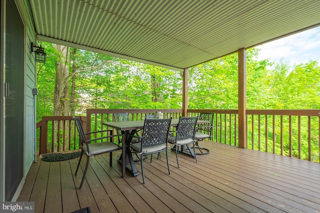 wooden terrace with outdoor dining area