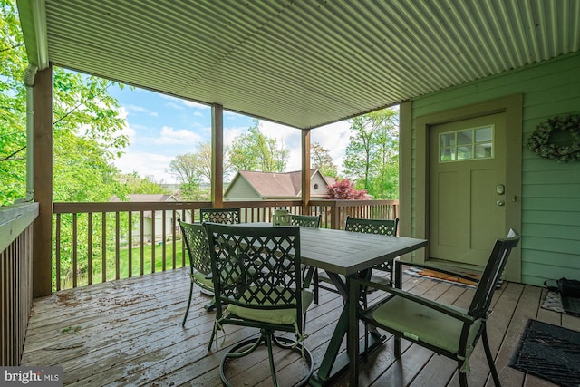 wooden terrace with outdoor dining area