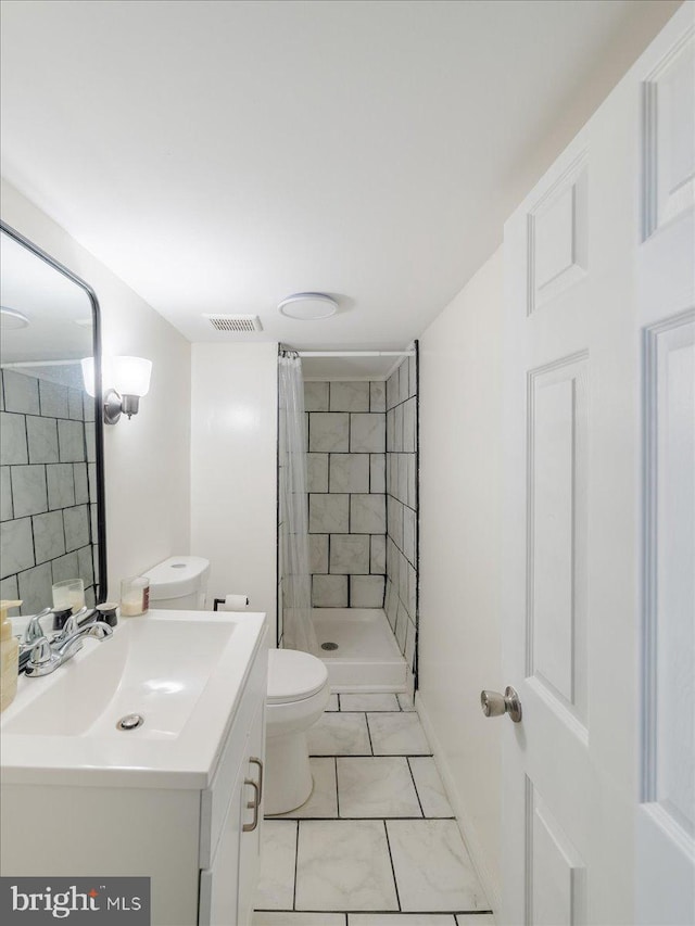 full bathroom featuring visible vents, toilet, marble finish floor, a shower stall, and vanity